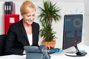 executive-woman-working-at-the-office-100261189